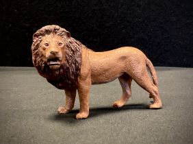 After Bergmann, a cold painted metal model, Standing Lion, 9.5cm long.