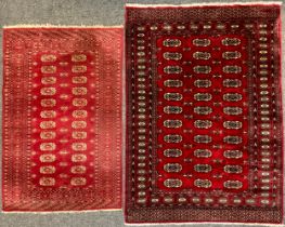 A Middle Eastern wool and silk mix Bokhara rug / carpet, 178cm x 124cm; another smaller, similar