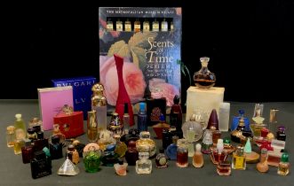 A selection of new and used perfume bottles; sample bottles and other sizes . Including Fidji,