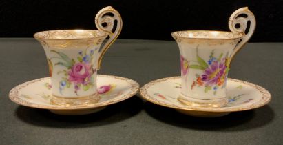 A near pair of 19th Century Dresden Demitasse Cups and Saucers, with ornate gold Quatrefoil