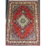 A Central Persian Sarouk woollen rug / carpet, central diamond-shaped medallion, within a field of