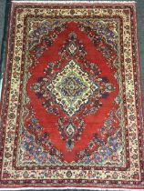 A Central Persian Sarouk woollen rug / carpet, central diamond-shaped medallion, within a field of