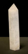 A Rock crystal white quartz obelisk of slightly tapering hexagonal form, 29cm high.