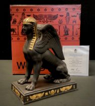 A Wedgwood limited edition Gilded Black Basalt figure Sitting Sphinx, limited edition no. 71 of 100,