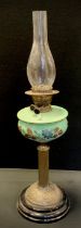 A early 20th century hand painted blue milk glass oil lamp on columned stand, swirl base, wooden