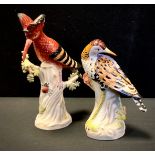 A pair of contemporary Sevres style porcelain figures, as Hoopoe bird and insect, and wadding