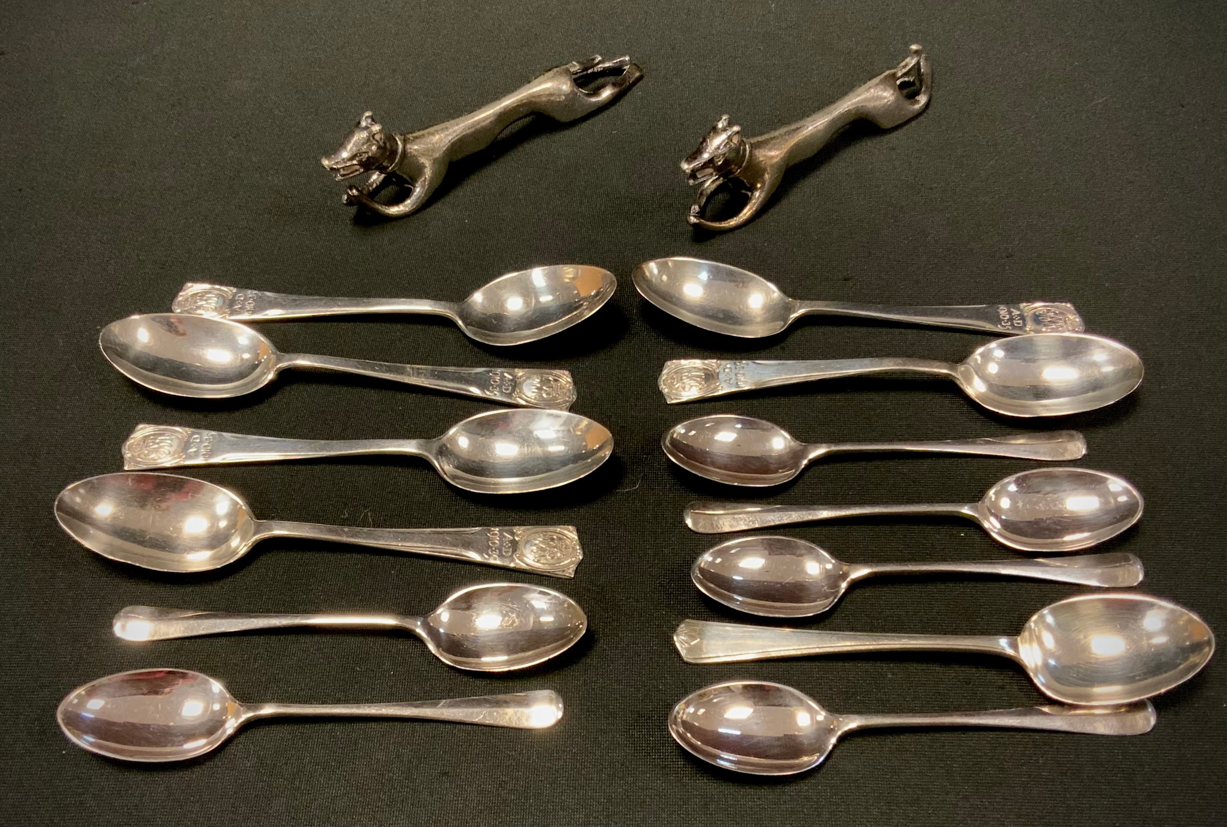 A set of six silver George V jubilee spoons, London 1935; others, 3.30zt; pair of silver plated