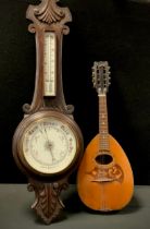 20th century wooden carved barometer,92cm high; an inlaid Neapolitan bow back mandolin, 61 cm