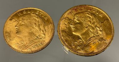 A Swiss Helvetia 20 franc gold coins, dated 1914, another 10 Franc, dated 1922, 9.6g gross (2)