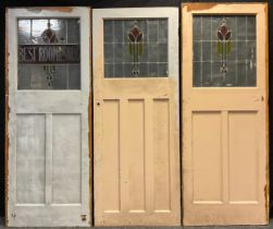 Architectural salvage - three early 20th century doors with stained glass panels, formerly from