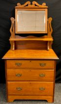 An early 20th century mahogany dressing chest, rectangular bevelled plate over single shelf, and