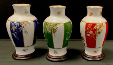 A set of three limited edition Franklin Mint vases; 'The vase of Noble Plum Blossom', 'The vase of