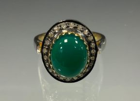 A 19th century style oval diamond and onyx ring, central green onyx oval cabochon, approx 3.95ct,