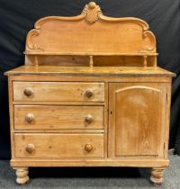 A Victorian pine Lincolnshire dresser, high quarter-galleried back, with carved c-scroll border, and