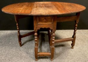 A George III oak gate-leg table, oval top, single drawer to frieze, turned supports, 71.5cm high x