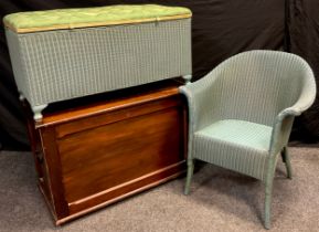 A Lloyd Loom ‘Lusty’ tub armchair, and a matching blanket chest; a stained pine blanket chest, (3).