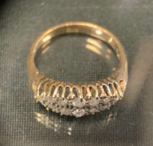 A diamond ring, set with twelve old and brilliant cut diamonds, total estimated diamond weights