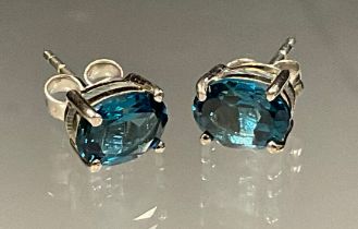 A pair of London blue topaz oval stud earrings, silver mounts, 1.9g gross
