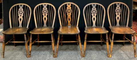 A 19th century Elm spindle-back chair, and a set of four similar 20th century chairs, (5).