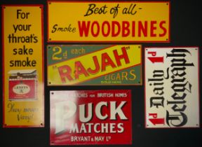 Enamel signs advertising 'The Daily Telegraph', 'Duck Matches', 'Craven A', 'Woodbines' ,'Rajah
