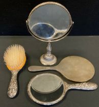 A silver hand mirror, engine turned back, London 1955; another mirror and brush, Birmingham 1971,