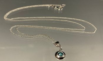 A fancy blue diamond single stone pendant necklace, collar set round brilliant cut blue diamond