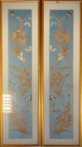 A pair of Japanese embroidered panels, each with a grasshopper and butterflies amongst branches,