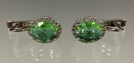 A pair of zultanite and cubic zirconia oval halo stud earrings, 925 silver mounts, 2.7g gross