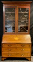 An Edwardian inlaid mahogany bureau bookcase, out swept cornice with inlaid Greek-key decoration,