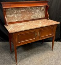 An Edwardian mahogany wash-stand, rouge-marble back-splash and top, above a pair of cupboards,