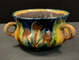 A West German majolica glaze tri-handled planter, art nouveau style, in tones of green, blue and