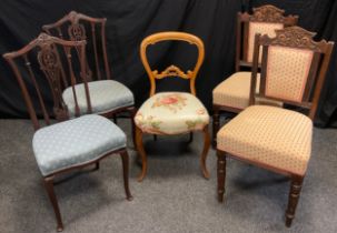 A Pair of Victorian carved mahogany chairs, serpentine shaped seats, 93.5cm high; another pair of