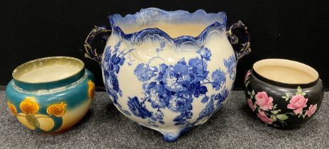 A large Doulton Lambeth Gloire De Dijon pattern blue and white jardinere, twin scrolling handles,