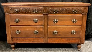 A French walnut sideboard, six graduated drawers, the top pair with carved fronts, turned feet, 91.