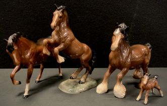 Beswick horses including Brown glazed foal, Cantering Shire horse, model 975; others (4)