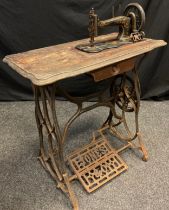 A 19th century Jones’ Family sewing machine, cast iron treadle base.