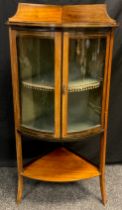 An Edwardian mahogany corner Vitrine cabinet, galleried top, bow-front with pair of glazed doors,