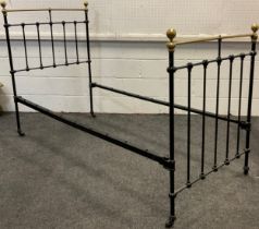 A Victorian cast iron and brass single bed frame.