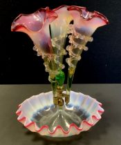 A Victorian Cranberry and Vaseline glass three-branch Epergne, wavy-edge circular base, 31.5cm