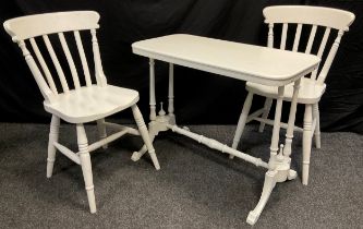 A pair of white painted beech wood chairs, and a white painted 19th century side table, (3).