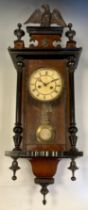 A Junghans mahogany cased musical Vienna clock, eagle cresting, turned and ebonised finials, white