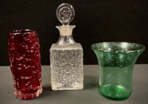 A Whitefriars ruby red bark vase, 19cm high, 8.3cm diameter; similar clear glass decanter and