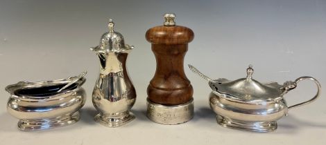 A matched silver three piece condiment set, salt, pepper and mustard, with spoons. William