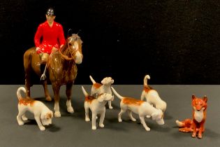 Beswick Huntswoman up on brown gloss horse, conforming five hounds and a fox (7)