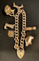 A 9ct gold charm bracelet, padlock clasp, suspending six charms, Pig, Miners Lamp, pair of Cowboy