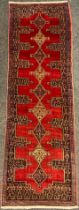 A North West Persian Senneh runner carpet, 255cm x 78cm.