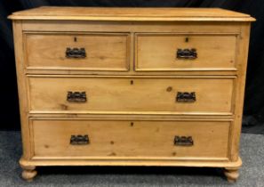 A Victorian pine chest of drawers, having two short, over two graduated long drawers, Art Nouveau