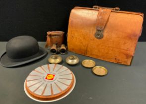 A pair of binoculars, Lincoln Bennet bowler hat, leather Gladstone bag, Shell Shine Territory Winner