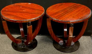 A pair of reproduction Art Deco style occasional tables, circular top, cradle-type pedestal base,