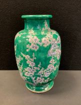 A 20th century Chinese vase, blossoming prunus on green ground, mark to base, 31cm high